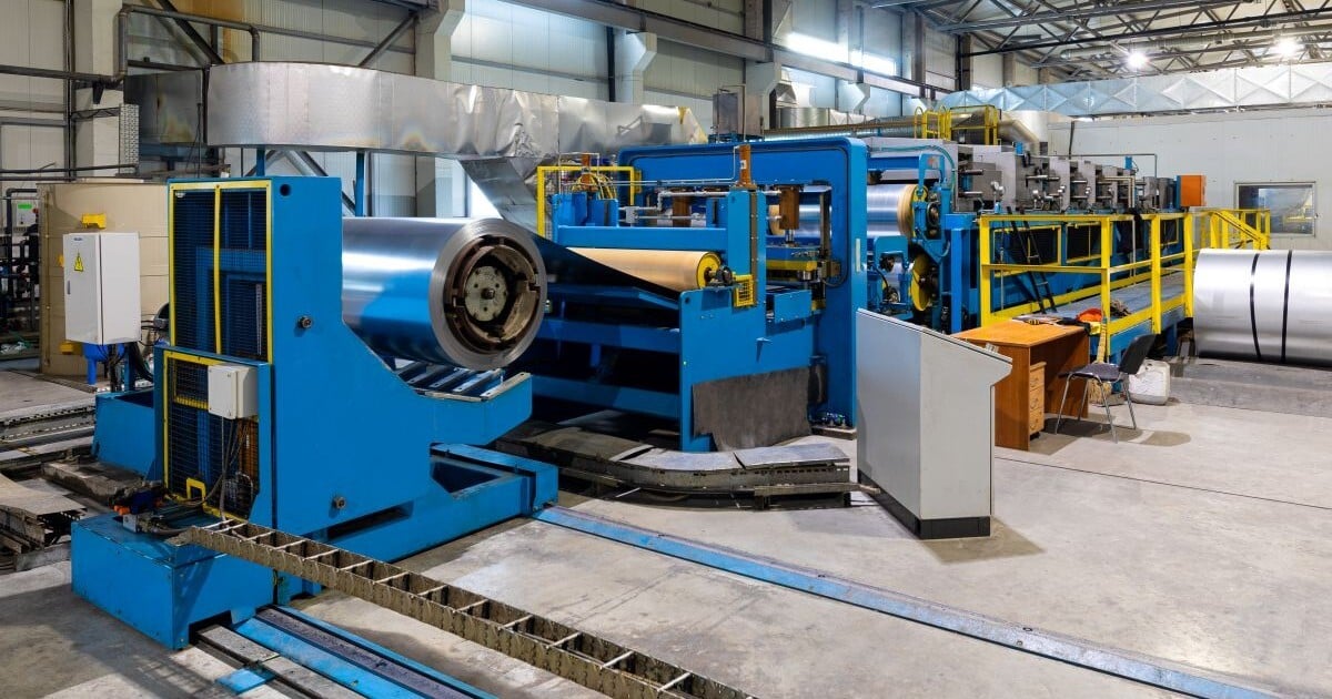Installed manufacturing equipment and industrial machinery in a metal processing facility.