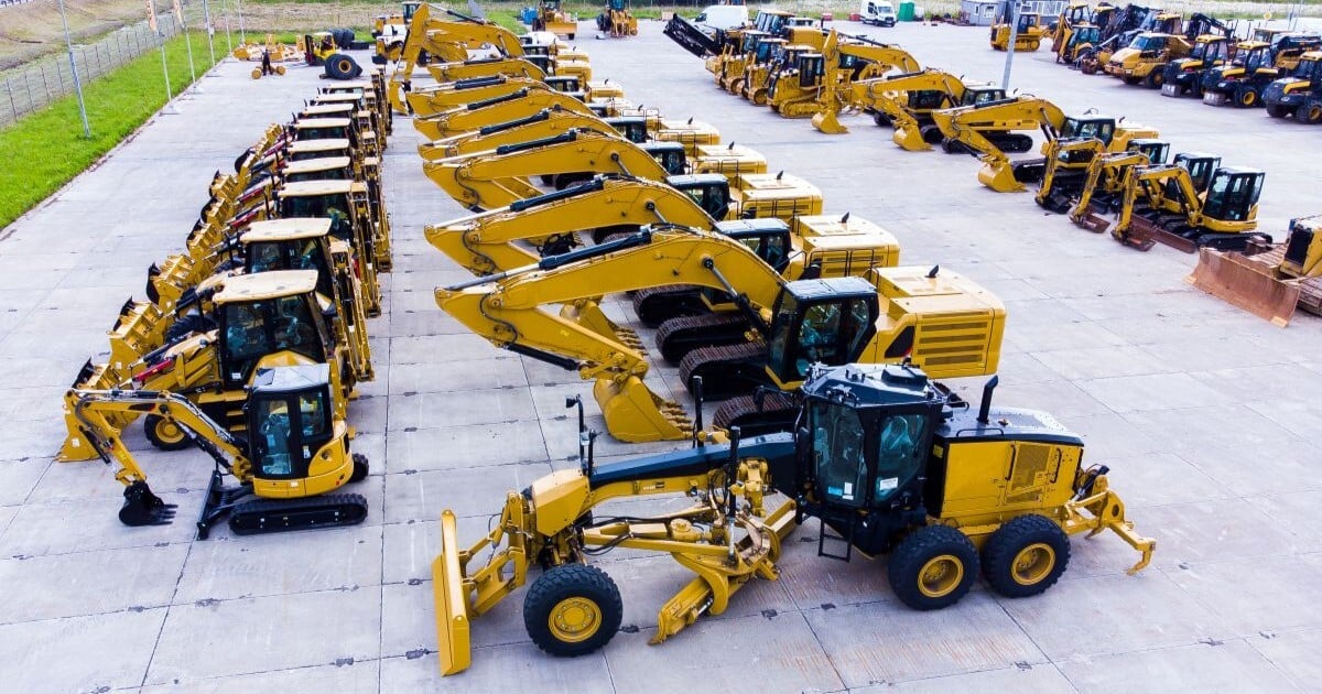 Rows of used excavators and construction equipment offered for sale at an equipment dealership. Online equipment listings are one source of market evidence used in machinery and equipment appraisals.